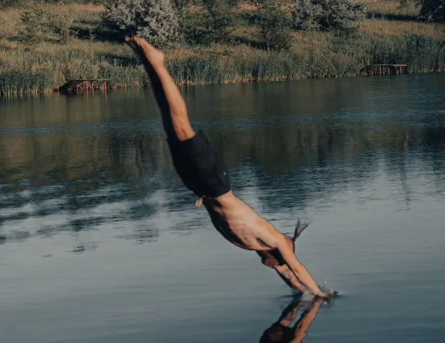 A man diving into cold water face first